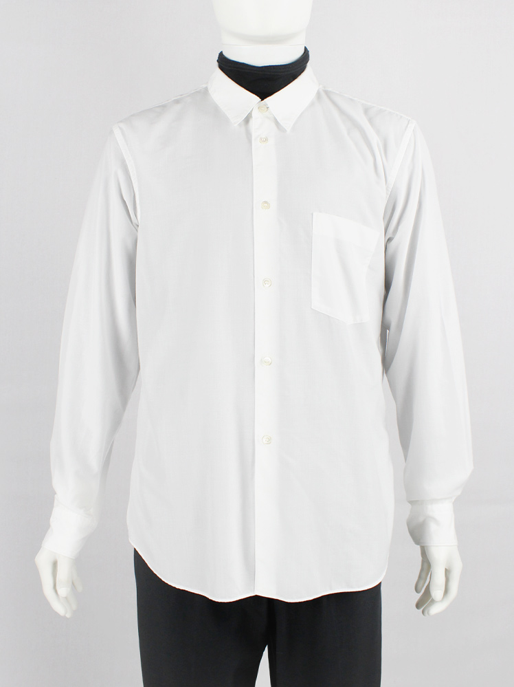 Comme des Garçons Homme Plus white shirt cut open on the Comme des Garçons Homme Plus white shirt cut open on the