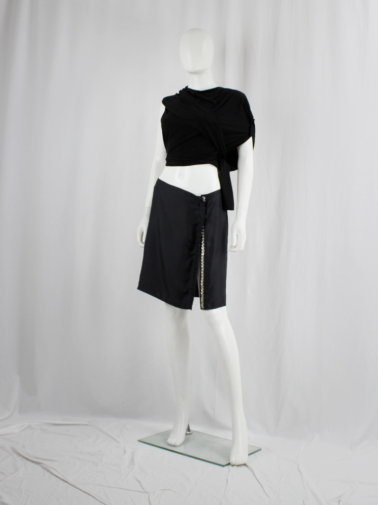 Ann Demeulemeester black mini skirt with silver snap buttons along