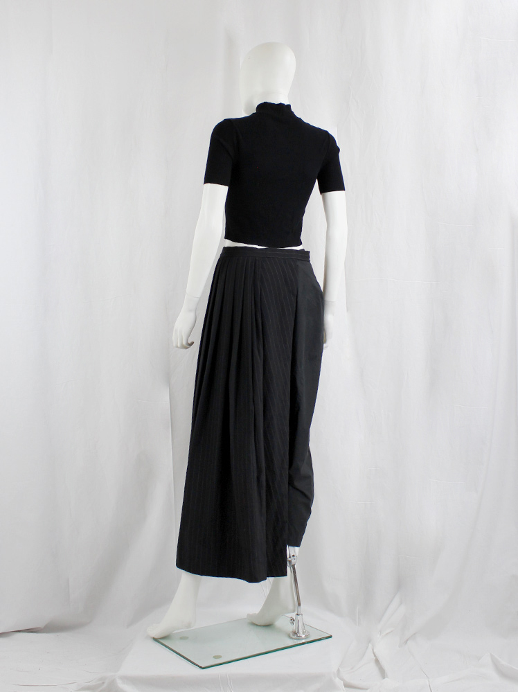 Comme des Garçons black pinstripe pleated half-skirt worn as side 