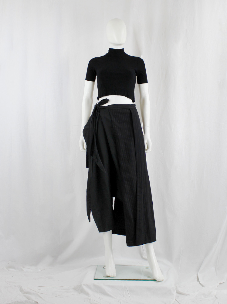 Comme des Garçons black pinstripe pleated half-skirt worn as Comme des Garçons black pinstripe pleated half-skirt worn as