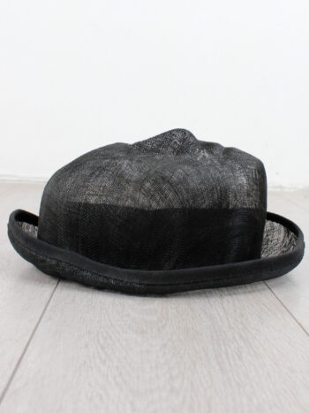 Christophe Coppens black transparent surrealist hat with a face
