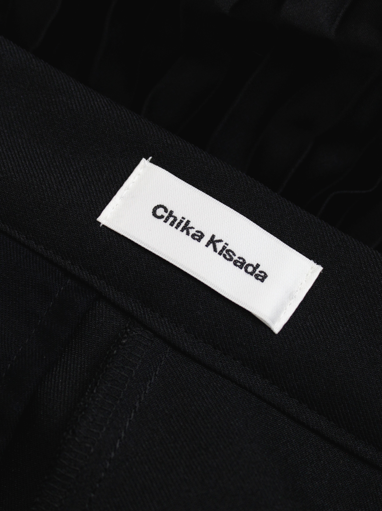 Chika Kisada black tailored pants with accordeon pleated half