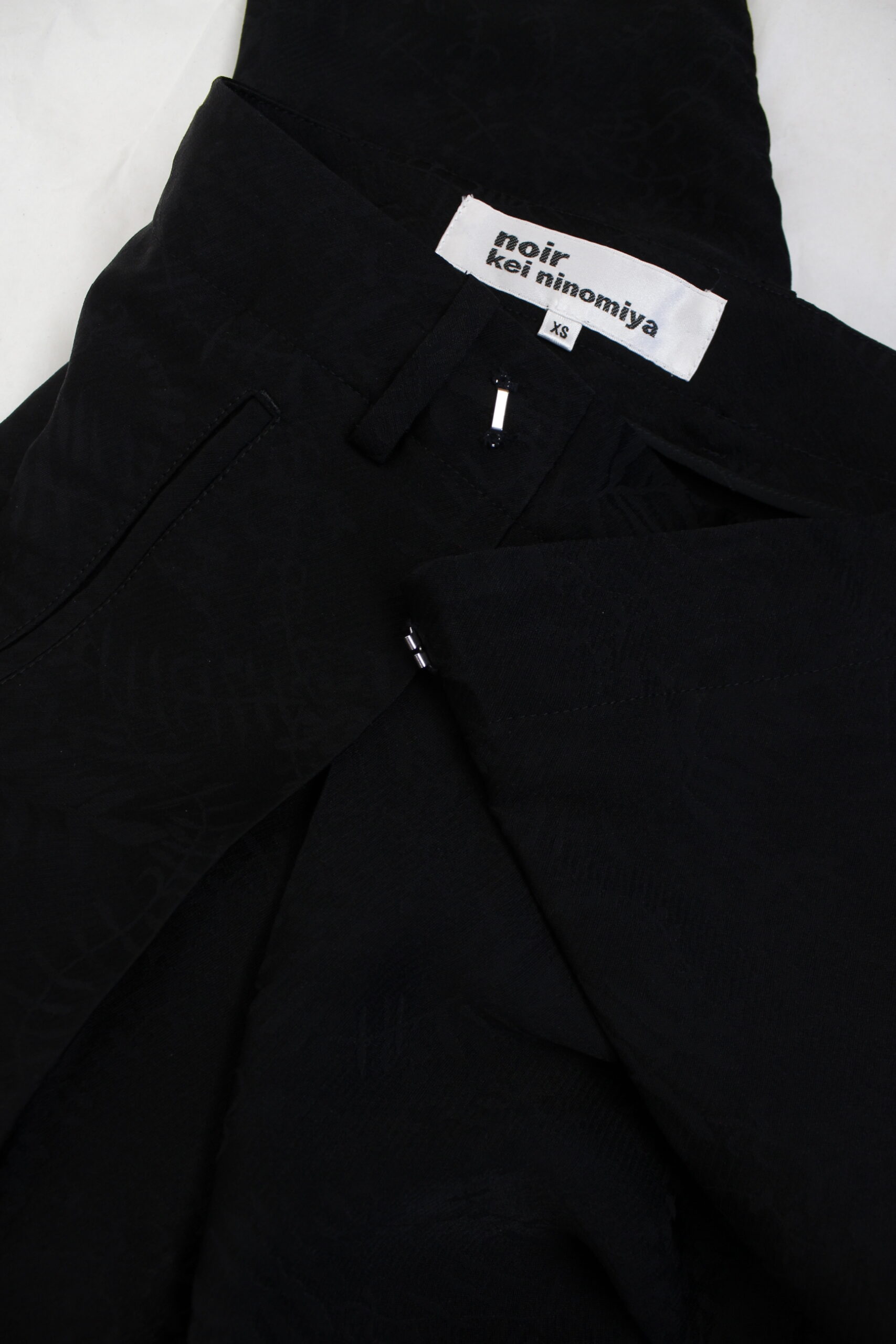 Noir Kei Ninomiya black brocade harem trousers with sharp front