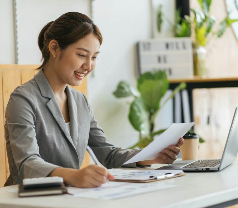 portrait-of-charming-successful-cheerful-focused-girl-working-remotely-creating-finance-it-presentat.jpg