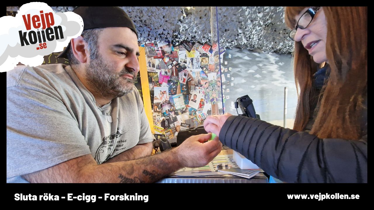 Smokers are helped in a roadside shop to choose a flavour and machine to quit smoking.