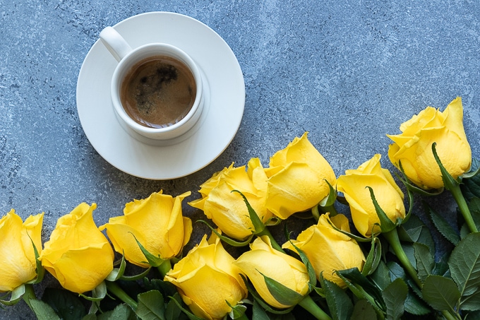 Coffee and yellow roses
