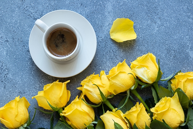 Coffee and yellow roses