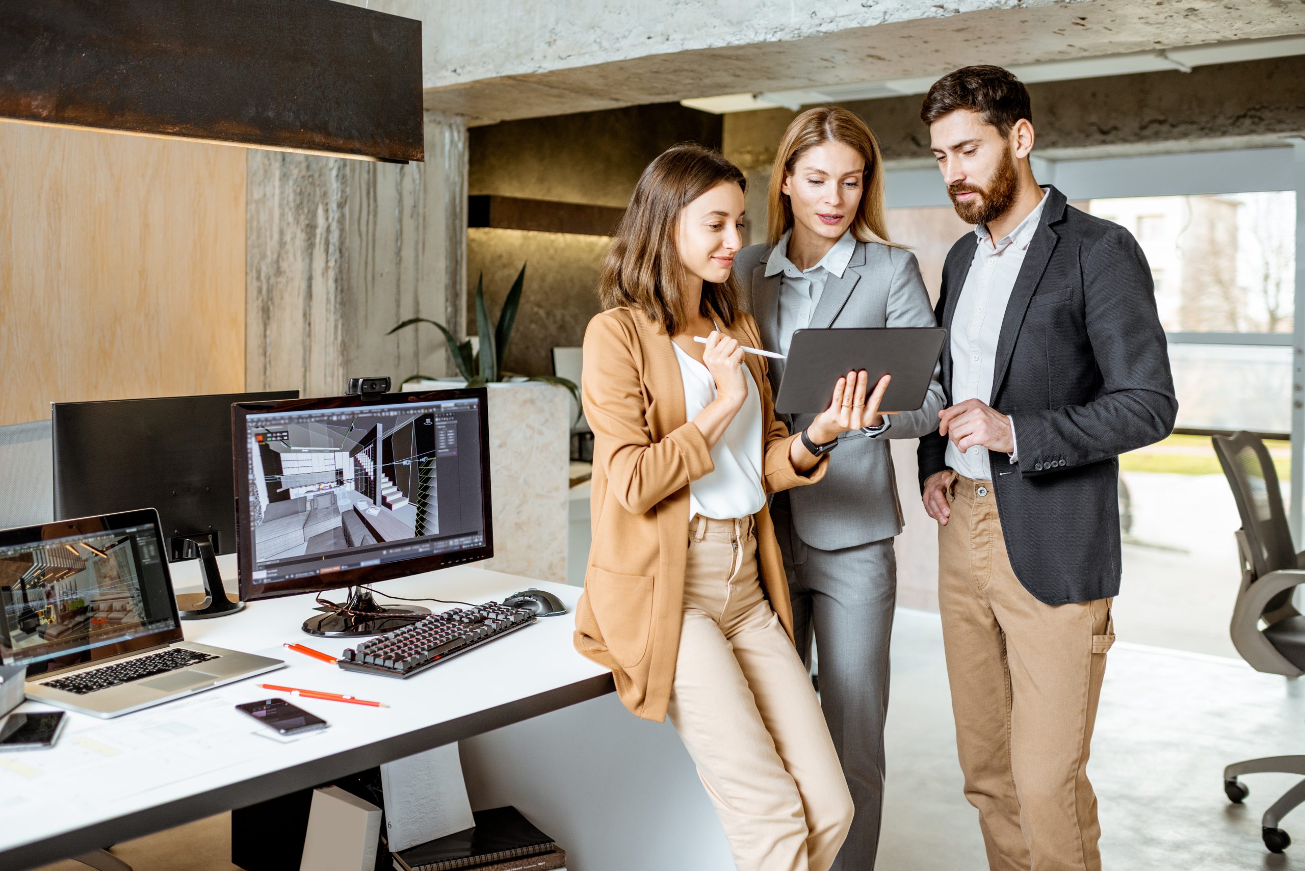 Colleagues working with digital tablet in the office
