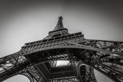 Eiffel tower in black and white during a sunny summer day