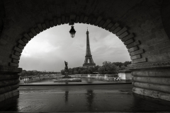 Black and white composition of eiffel tower with bridge forming frame Paris France