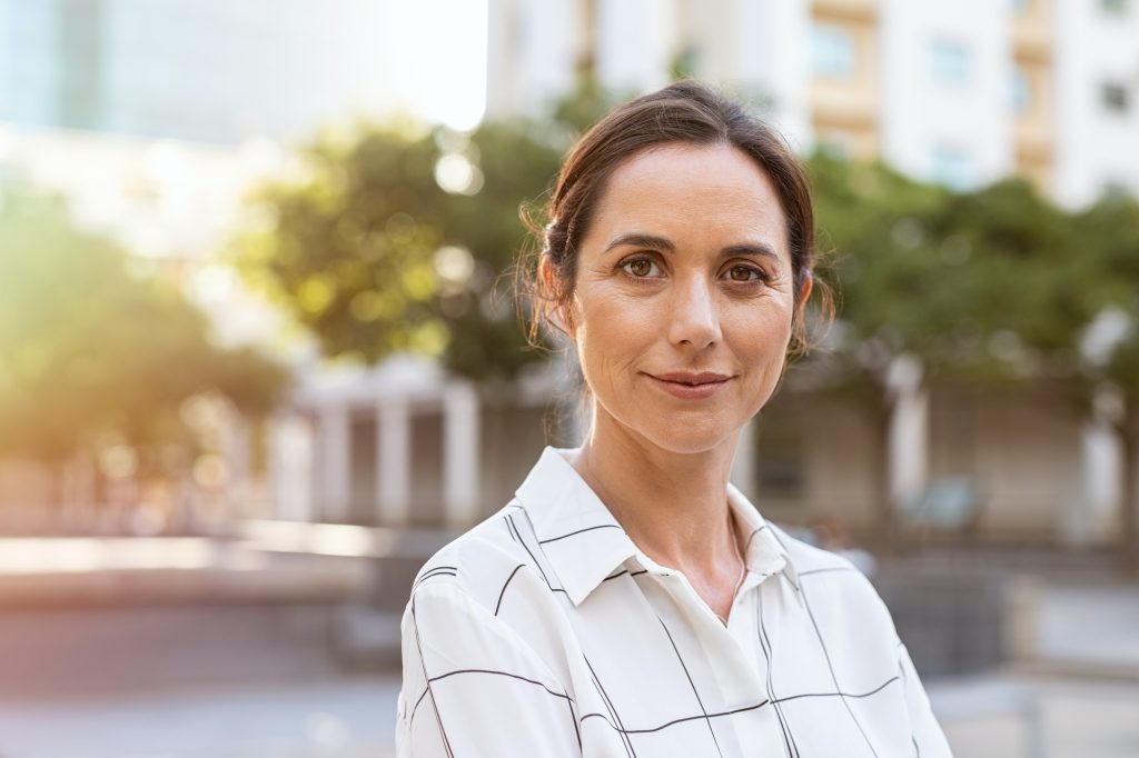 Successful mature woman looking at camera