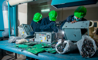 wayeco-workers-dismantling-old-pcs-electronic-waste