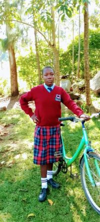 She is one of WAY Empowerment NGO bicycle beneficiaries in Kenya. Now she can cycle to school instead of having to walk 2 hours each way.