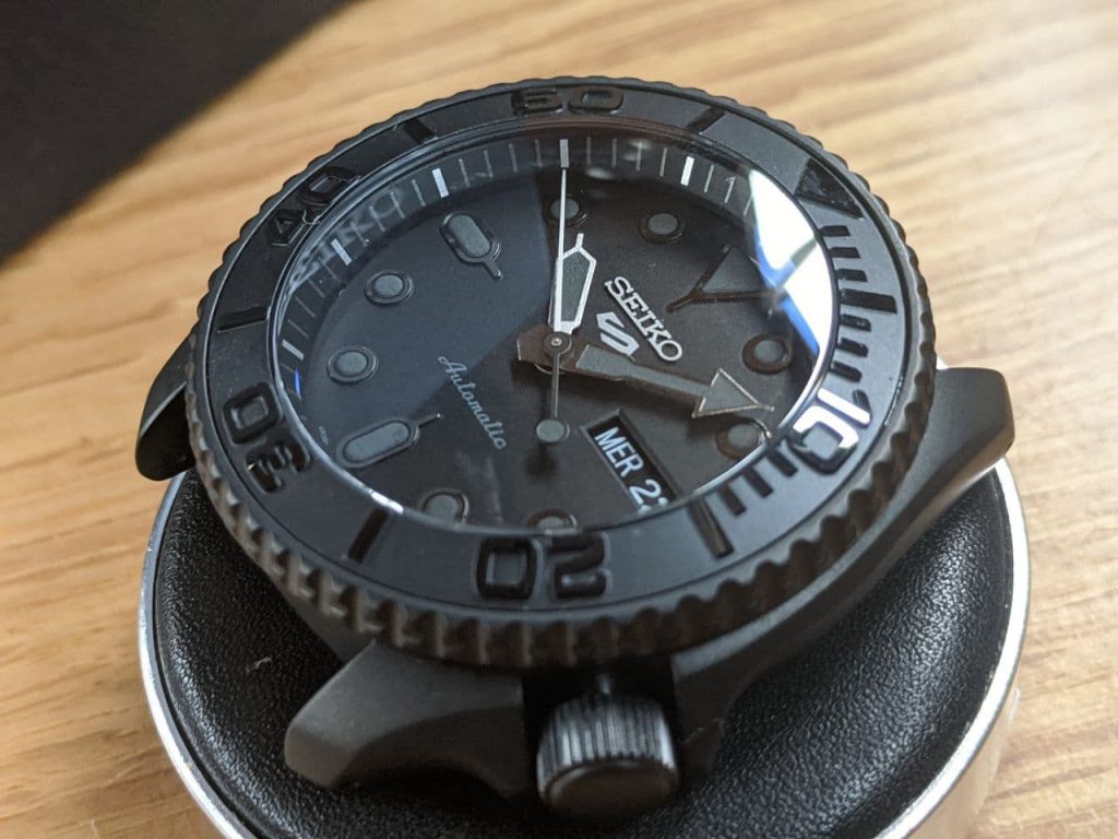 Seiko Mod by Welingtime UK. Seiko SRPD79 Mod - Stealth Yacht Master: A Seiko SRPD with a black case and black bezel . The watch has bee modified to include a double dome sapphire crystal with a blue AR coating and a black Yacht Master bezel insert.