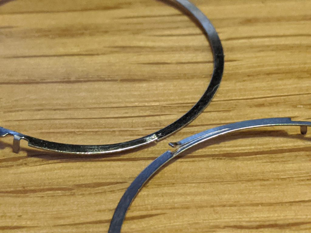 Seiko Bezel Spring repair / replace - A worn spring and a new spring for comparison. wear can be seen on the above (old) spring. The new spring is below. 