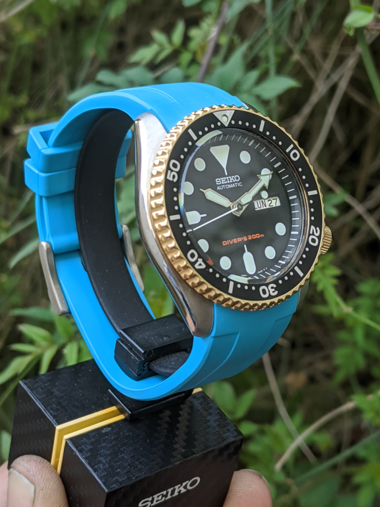 Gold Seiko - Seiko SKX007 OEM Gold Plated Bezel & Crown, with light blue strap.