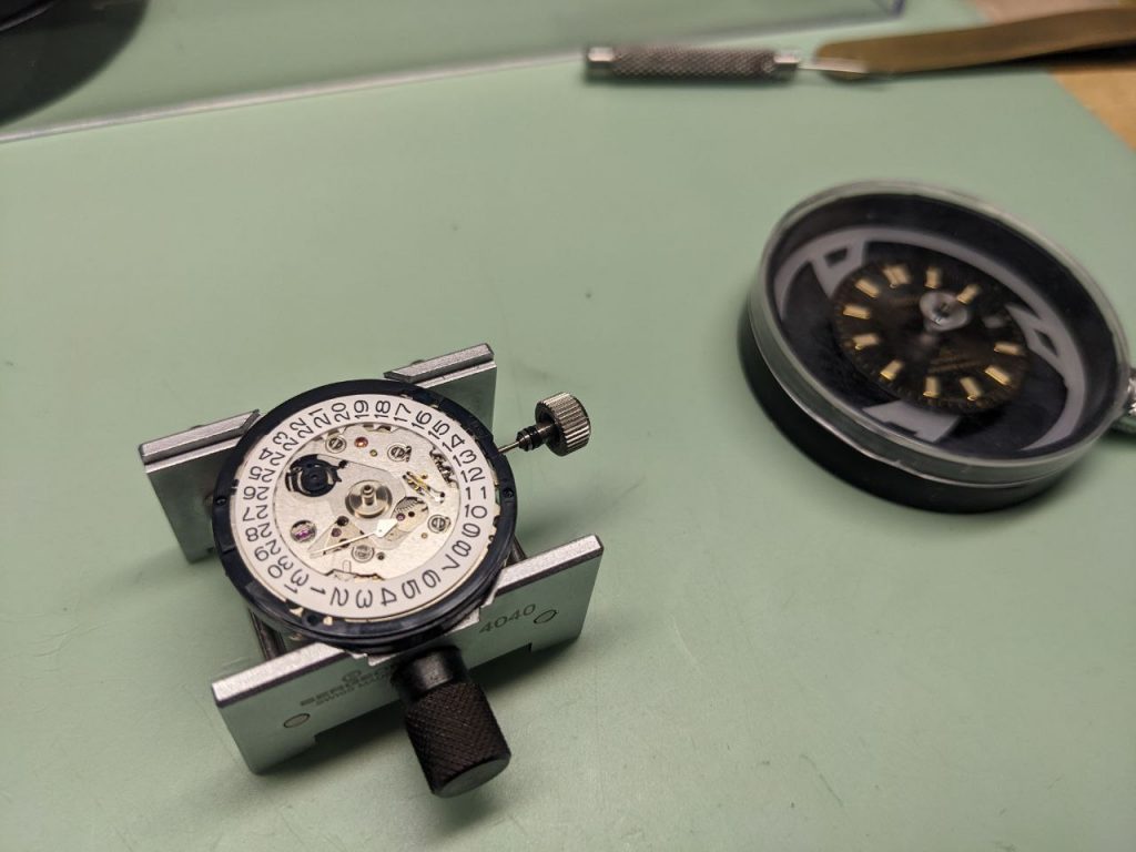 Seiko 6R35 Repair - movement in holder with dial and hands removed