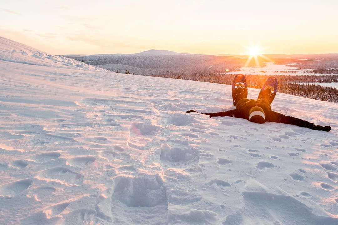 Snowshoer lying on snow