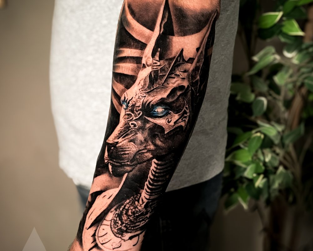 Egyptian mythology Anubis tattoo realistic arm piece