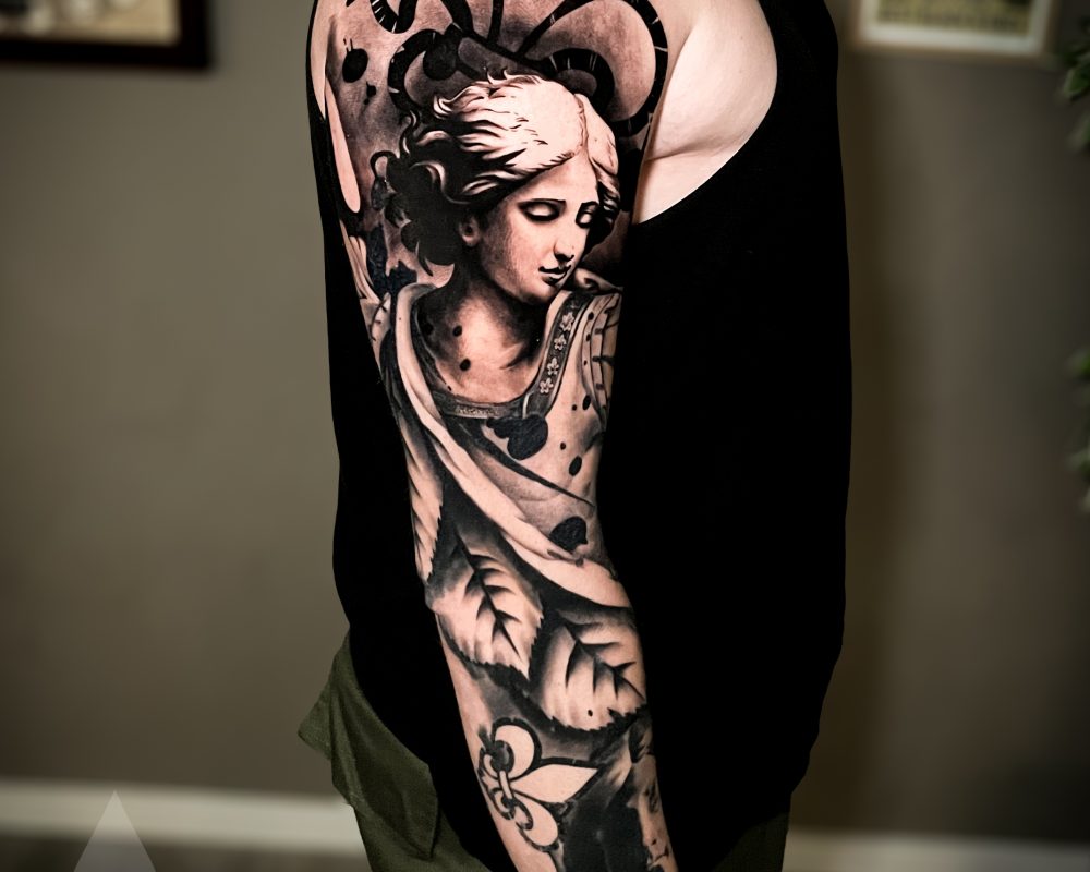 Arch angel religious graphical realism high contrast arm sleeve tattoo