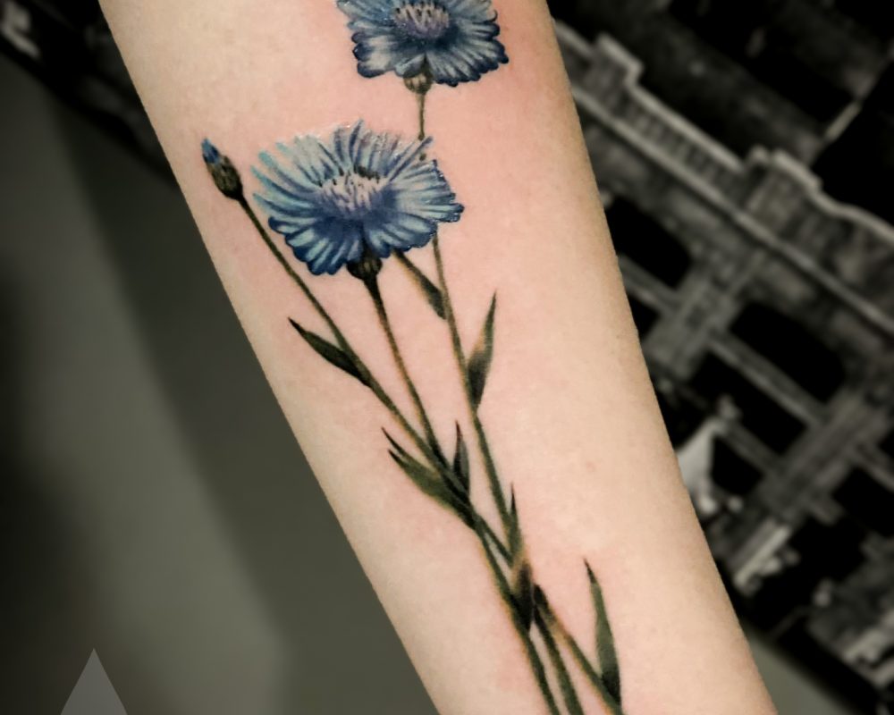 Blue realistic field flowers tattoo