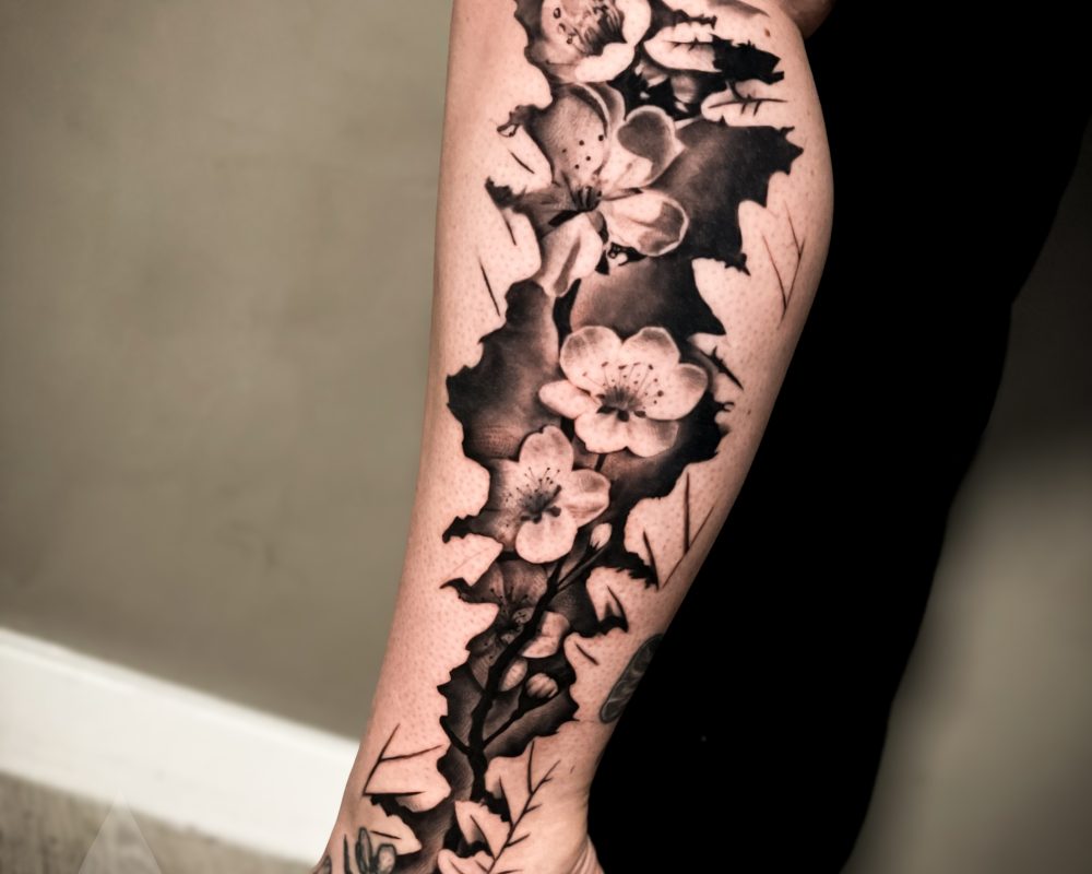 Cherry blossom feminine leg sleeve tattoo design
