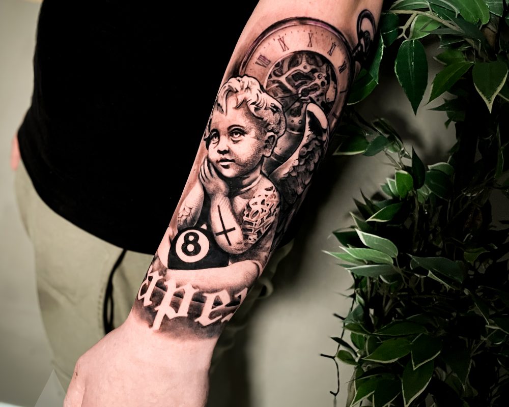 Chicano angel statue arm tattoo piece