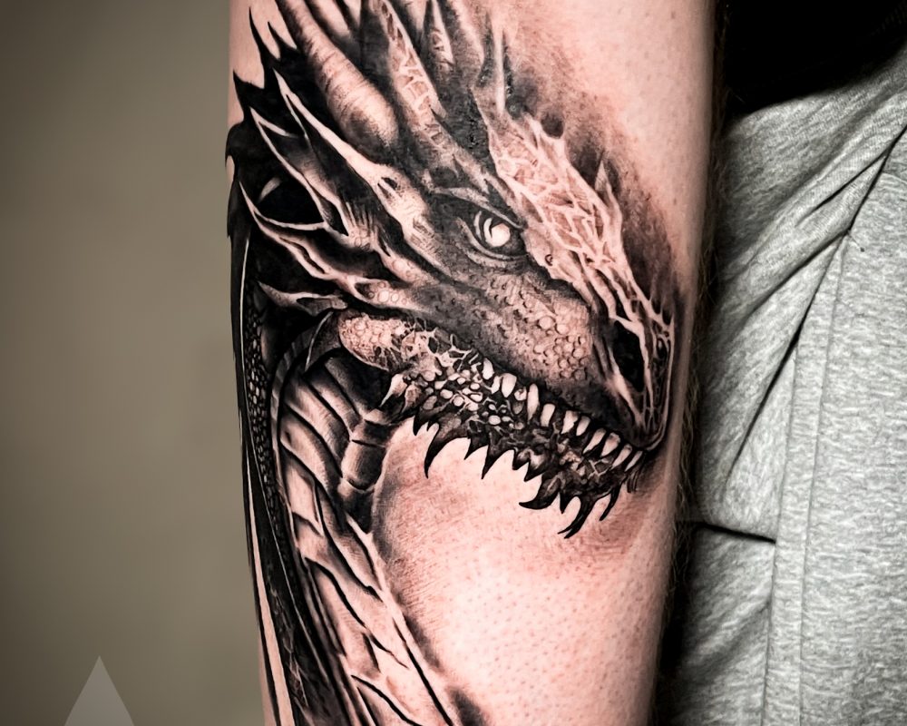 Realistic Nordic dragon arm tattoo piece