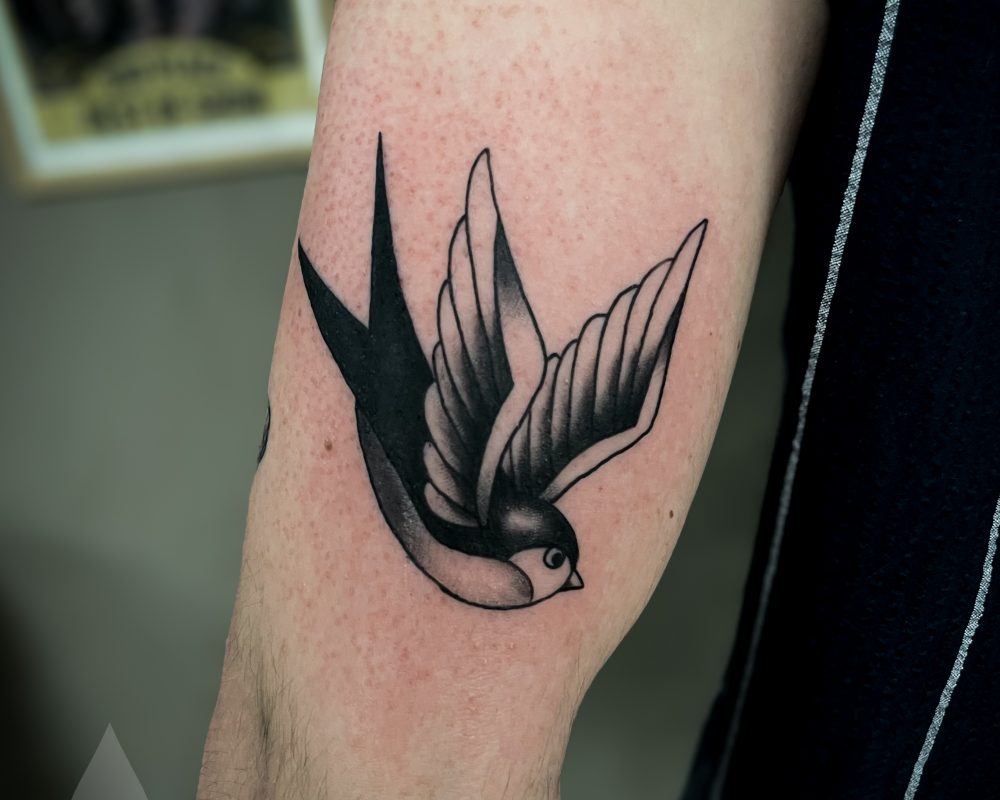 Old school swallow tattoo