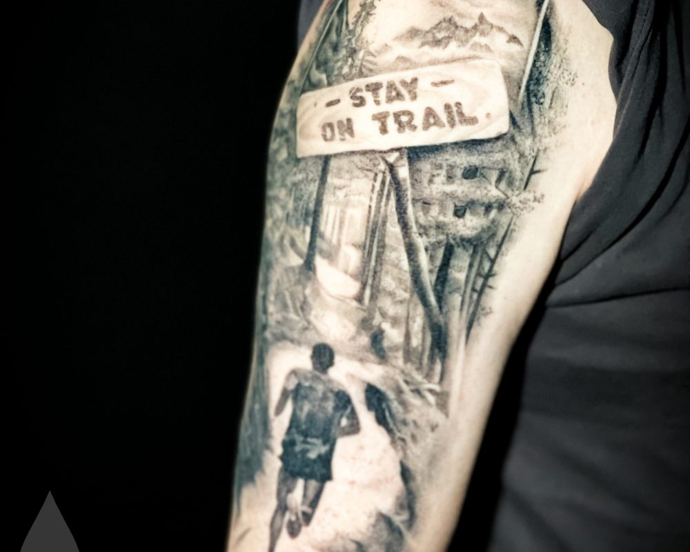 Trail runner running hobby tattoo healed