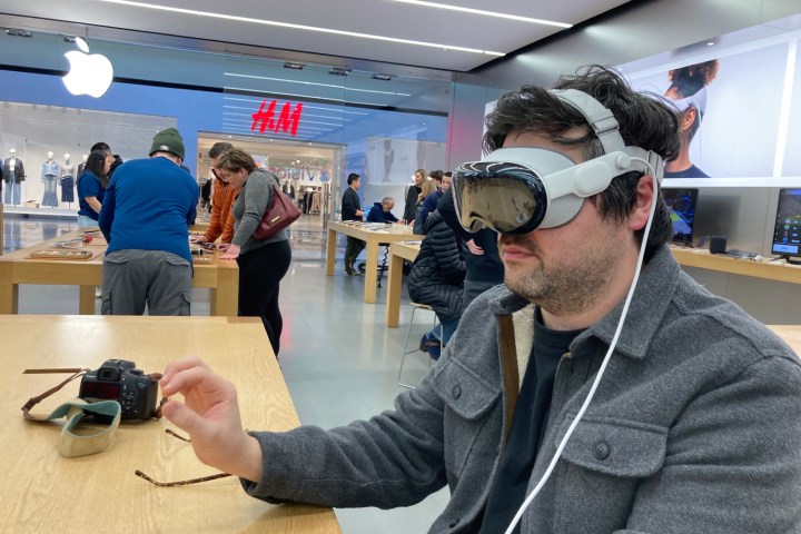 Someone using a Vision Pro demo at an Apple Store.