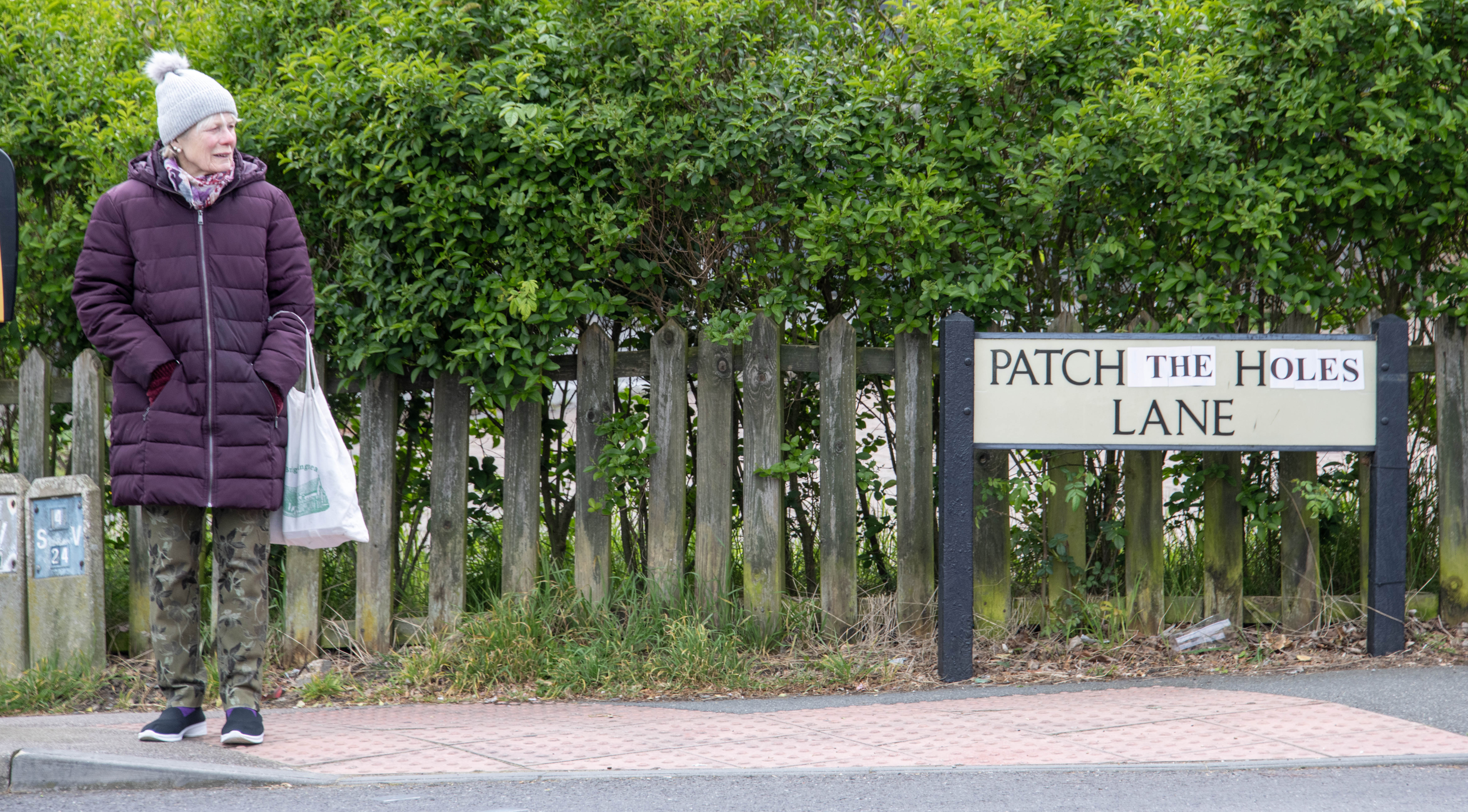 A prankster has changed the sign on a pothole- ridden road named Patching Hall Lane — to read Patch The Holes Lane