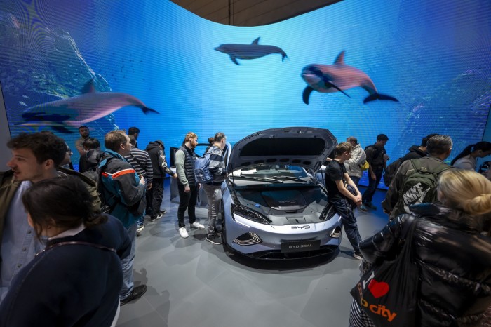 Visitors gather near BYD’s new car Seal at the Geneva International Motor Show