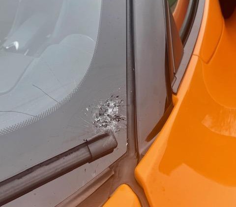 The impact left a significant crack in the windscreen of the £200,000 McLaren 720S