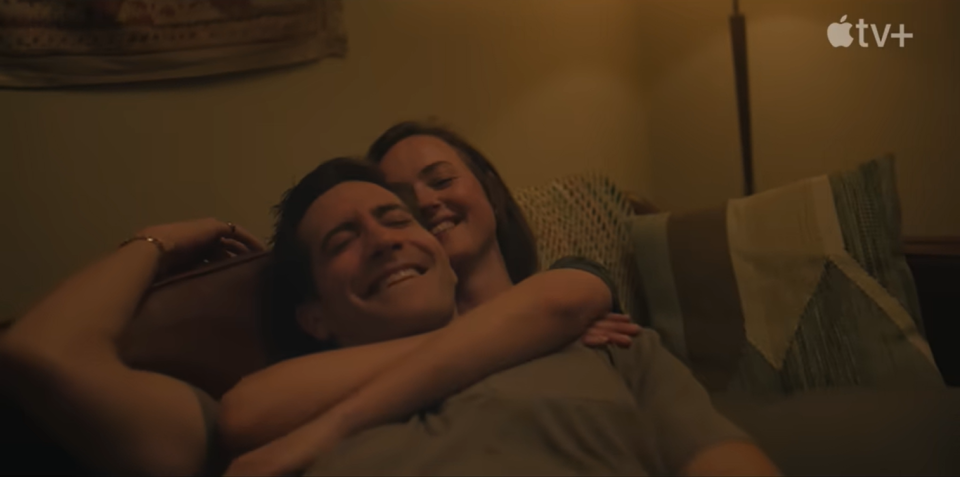 presumed innocent trailer, jake gyllenhaal and renate reinsve lie on a sofa with their arms around each other