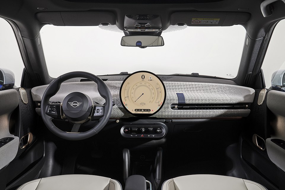 Inside, it's a modern twist on the classic Mini cabin. Replicating the original's centrally-mounted speedometer is the world's largest round OLED touchscreen display to feature in a car