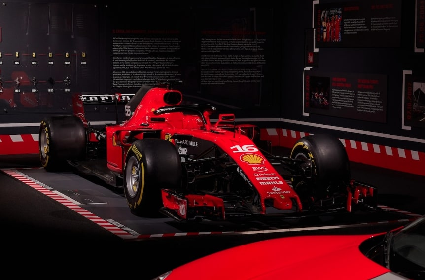 The hand-stitched bed is surrounded by some of the company's most famous F1 cars