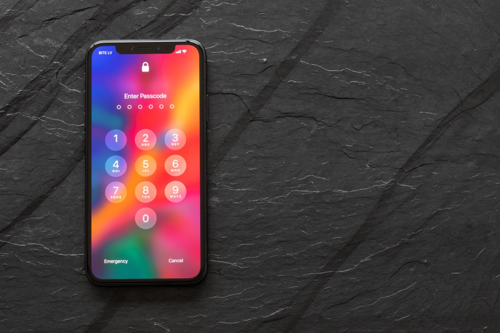 iPhone X with locked screen showing 