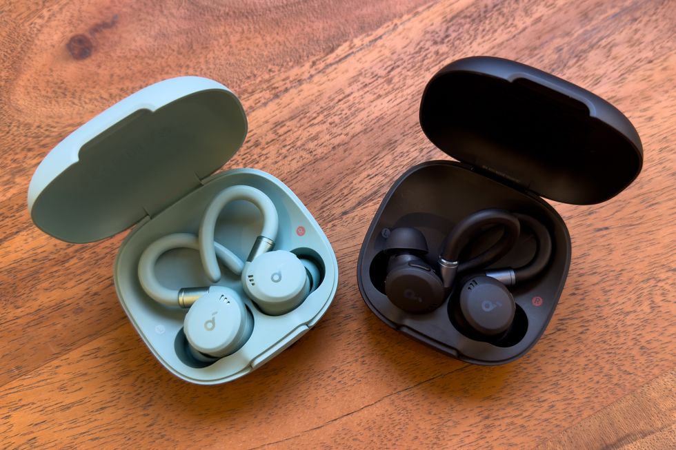 two soundcore sport x20 wireless earbuds in their cases on a table