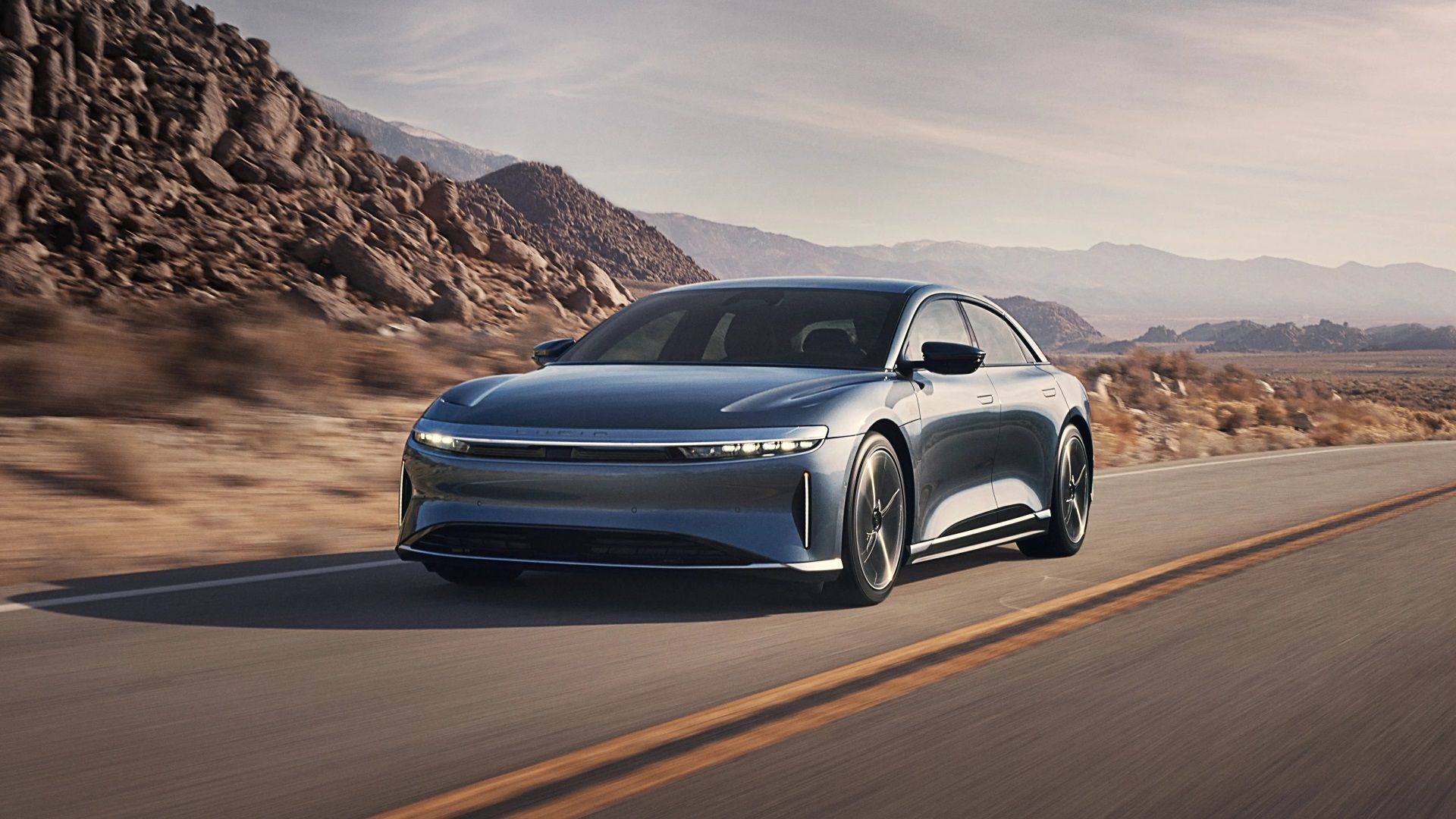 Silver Lucid Air Pure front-quarter tracking