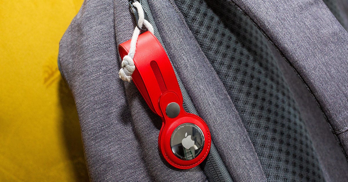 Red Apple AirTag attached to a backpack