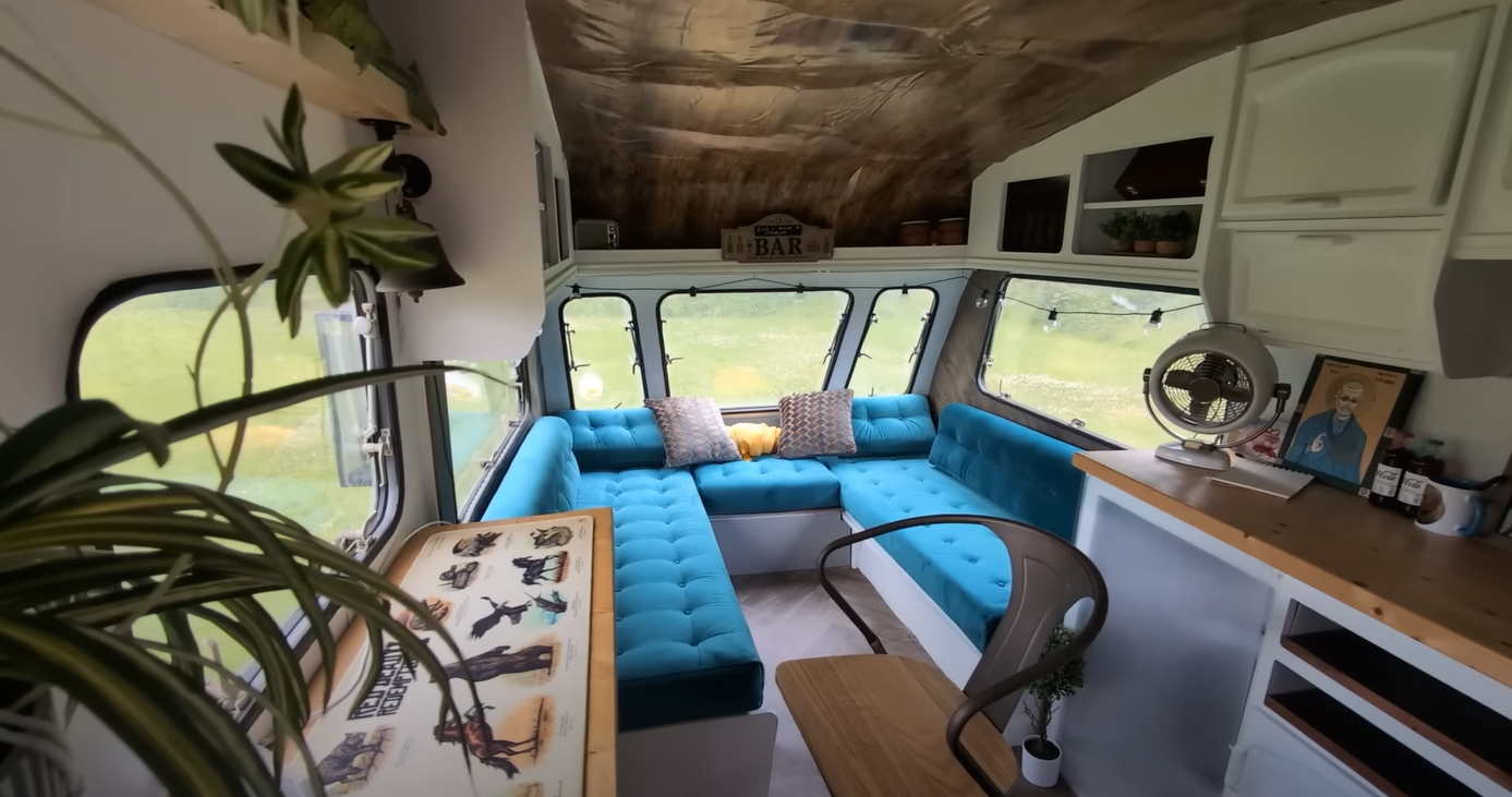 Kevin put in blue seating to match the outside of the caravan