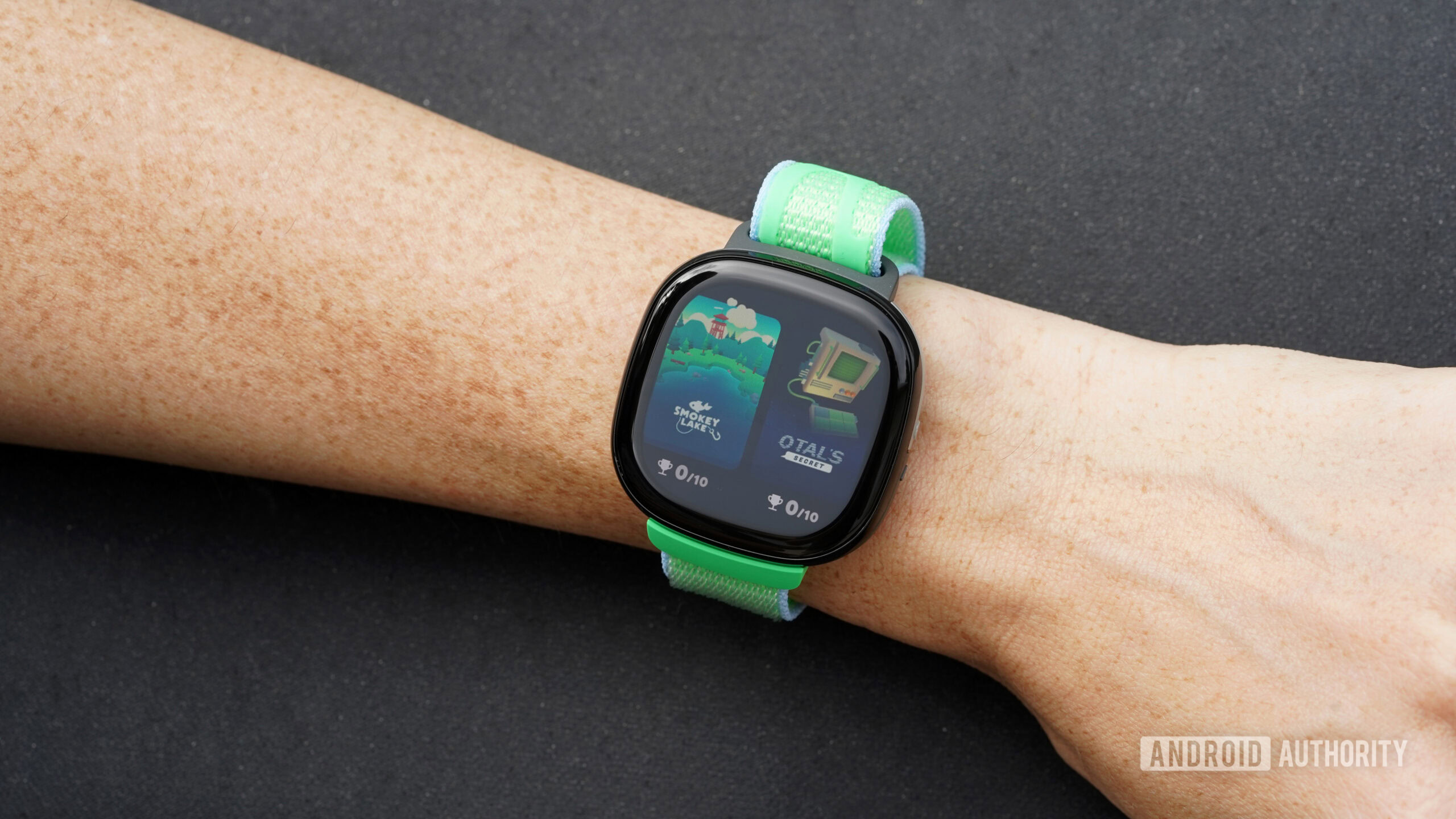 A Fitbit Ace LTE displays available games within Fitbit Arcade.