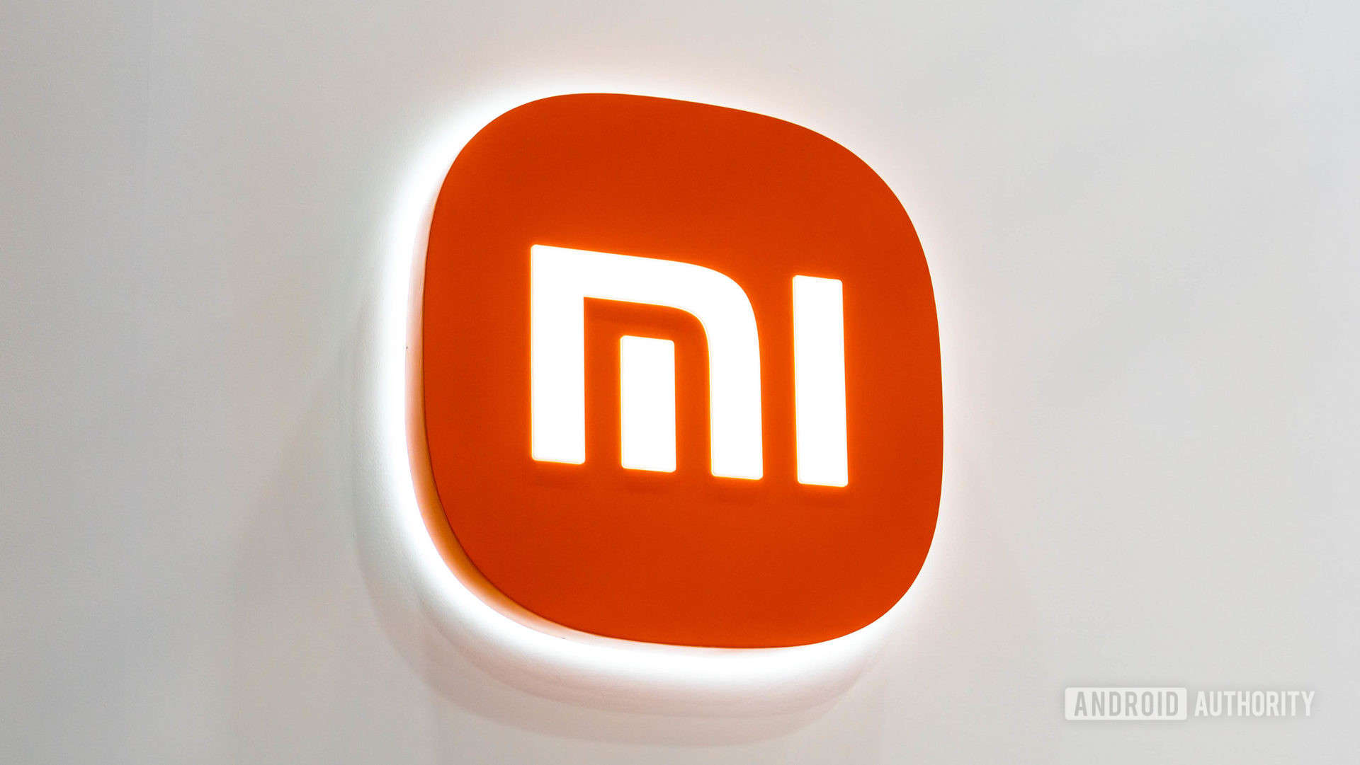 Xiaomi Mi logo on white wall