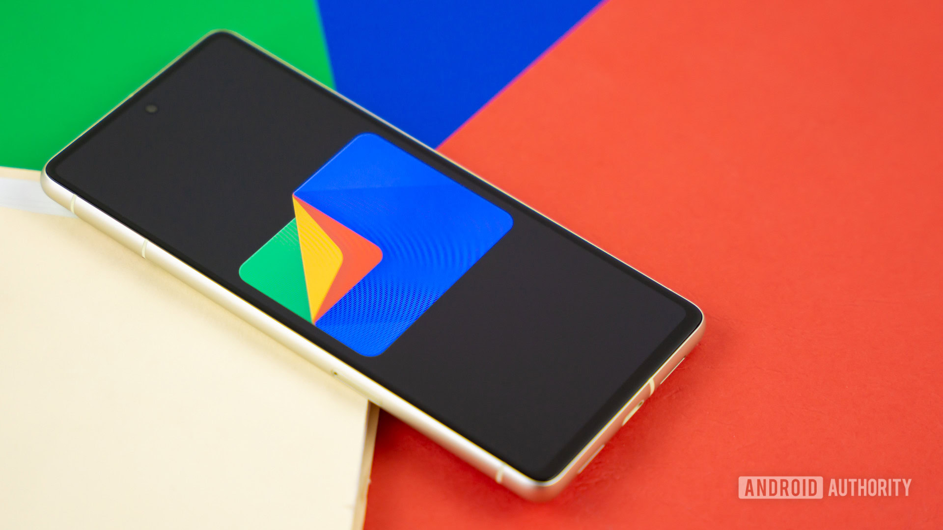 Google Files app logo on smartphone with manila folder and colorful background Stock photo 5