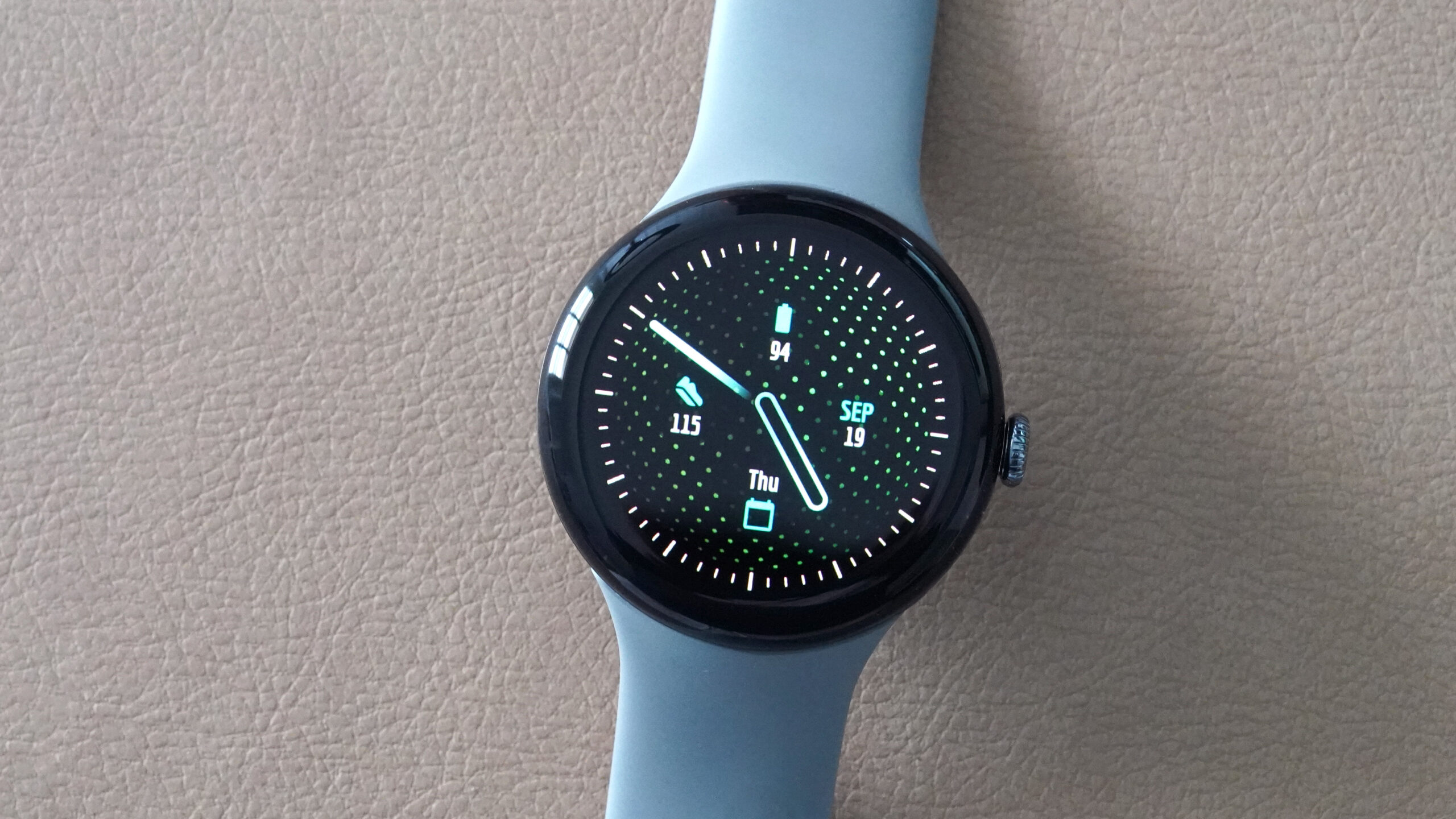 A Google Pixel Watch 3 diusplays the watch face Blue Lagoon.