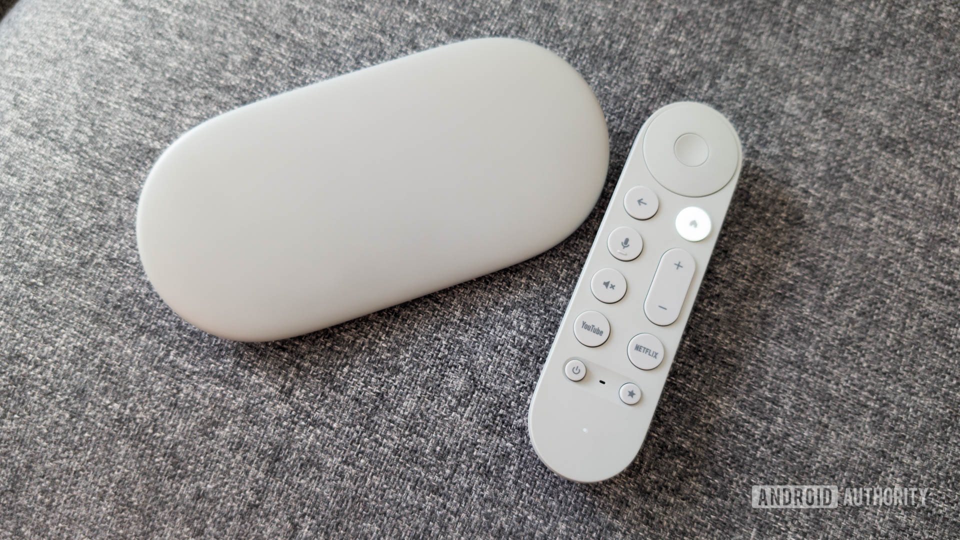 Google TV Streamer with remote on couch