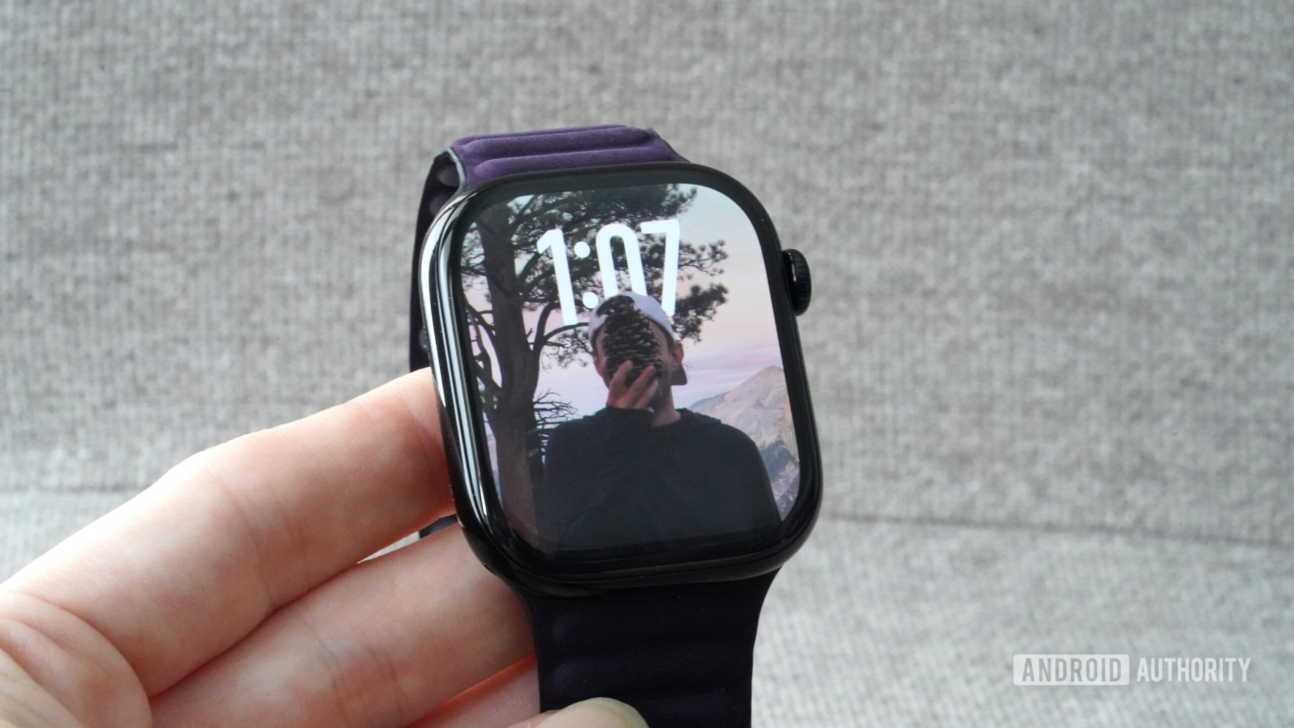 An Apple Watch Series 10 displays the watch face Photos