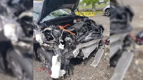 Michael Shapiro The Uber car after the crash, with the bonnet destroyed and the engine extensively damaged