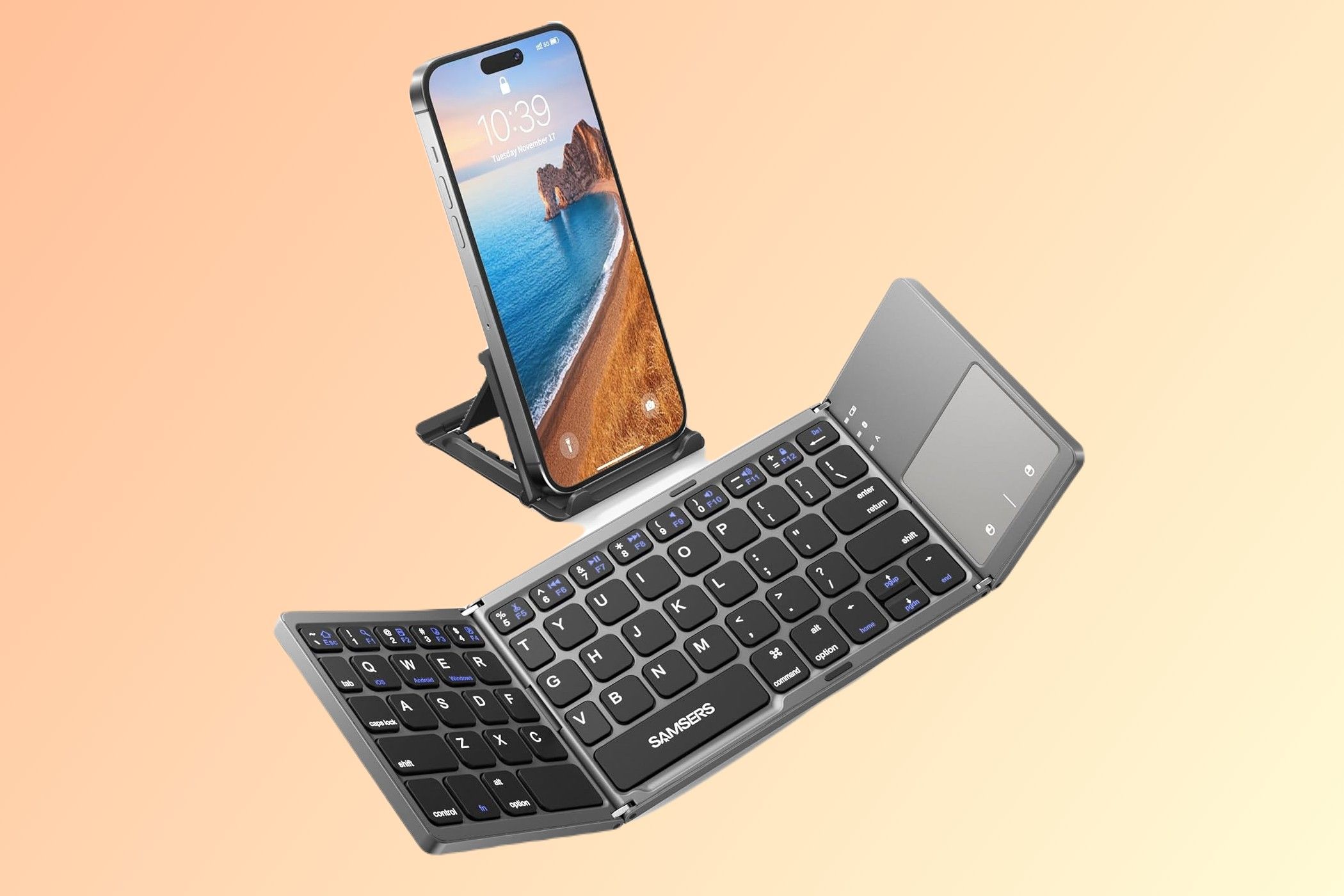 A phone on a stand and the Samsers Foldable Bluetooth Keyboard on a gradient background.